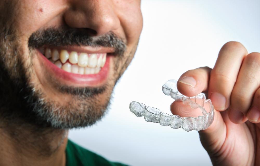 Man holding Invisalign
