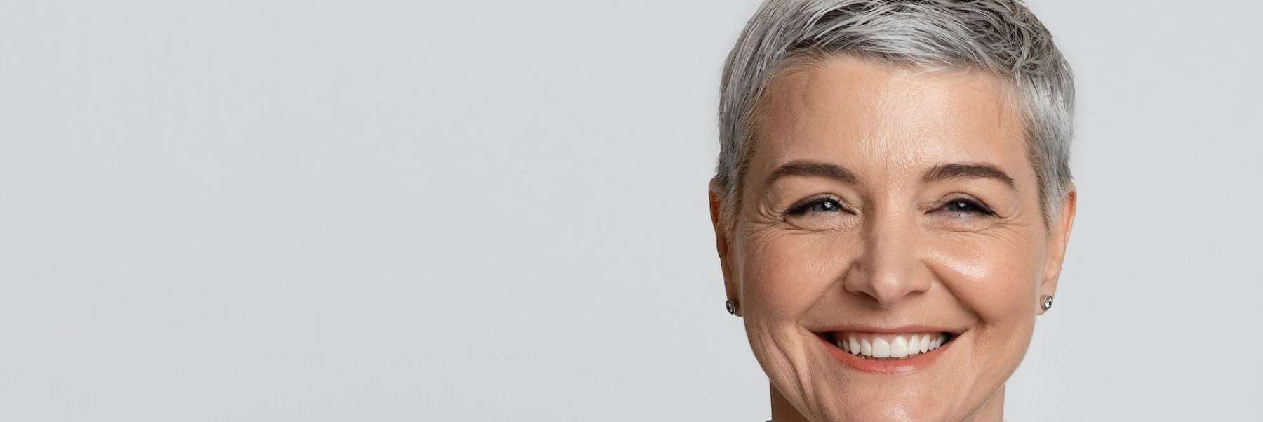 woman with gray hair smiling